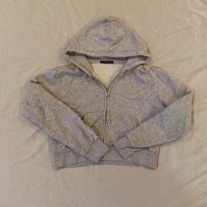 Brandy Melville. Grey sip up cropped hoodie. One size fits all.